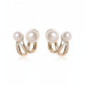 Boucles d'oreilles perles Apolline, la paire sur fond blanc