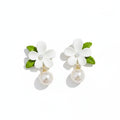 Boucles d'oreilles perles Capucine, la paire sur fond blanc